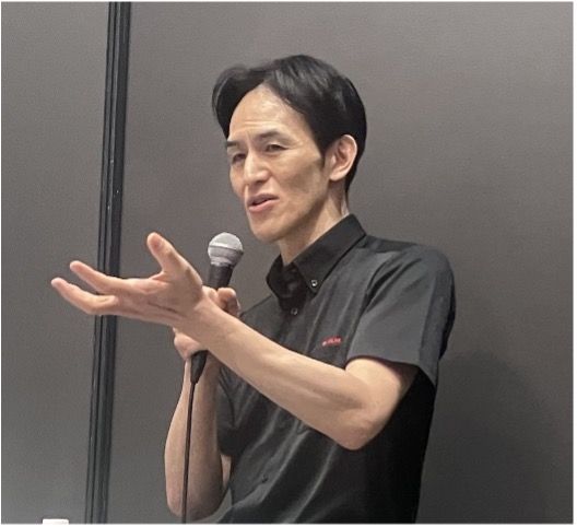 Man speaking at tech conference presentation