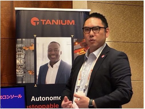 Man presenting at Tanium technology conference